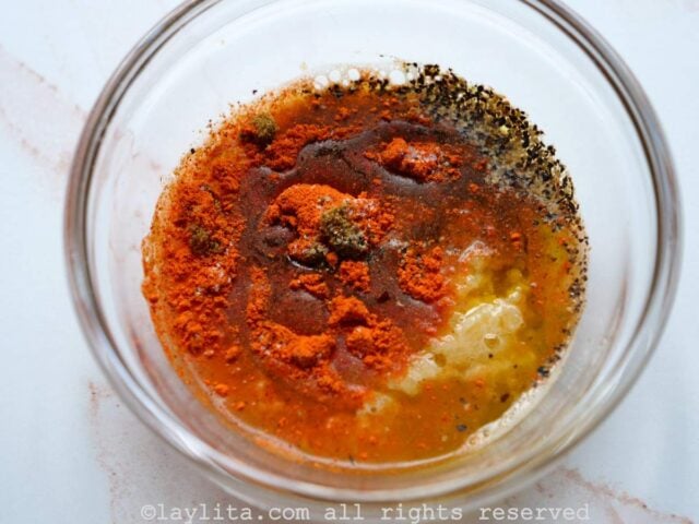 Ingredients for achiote marinade in a glass bowl