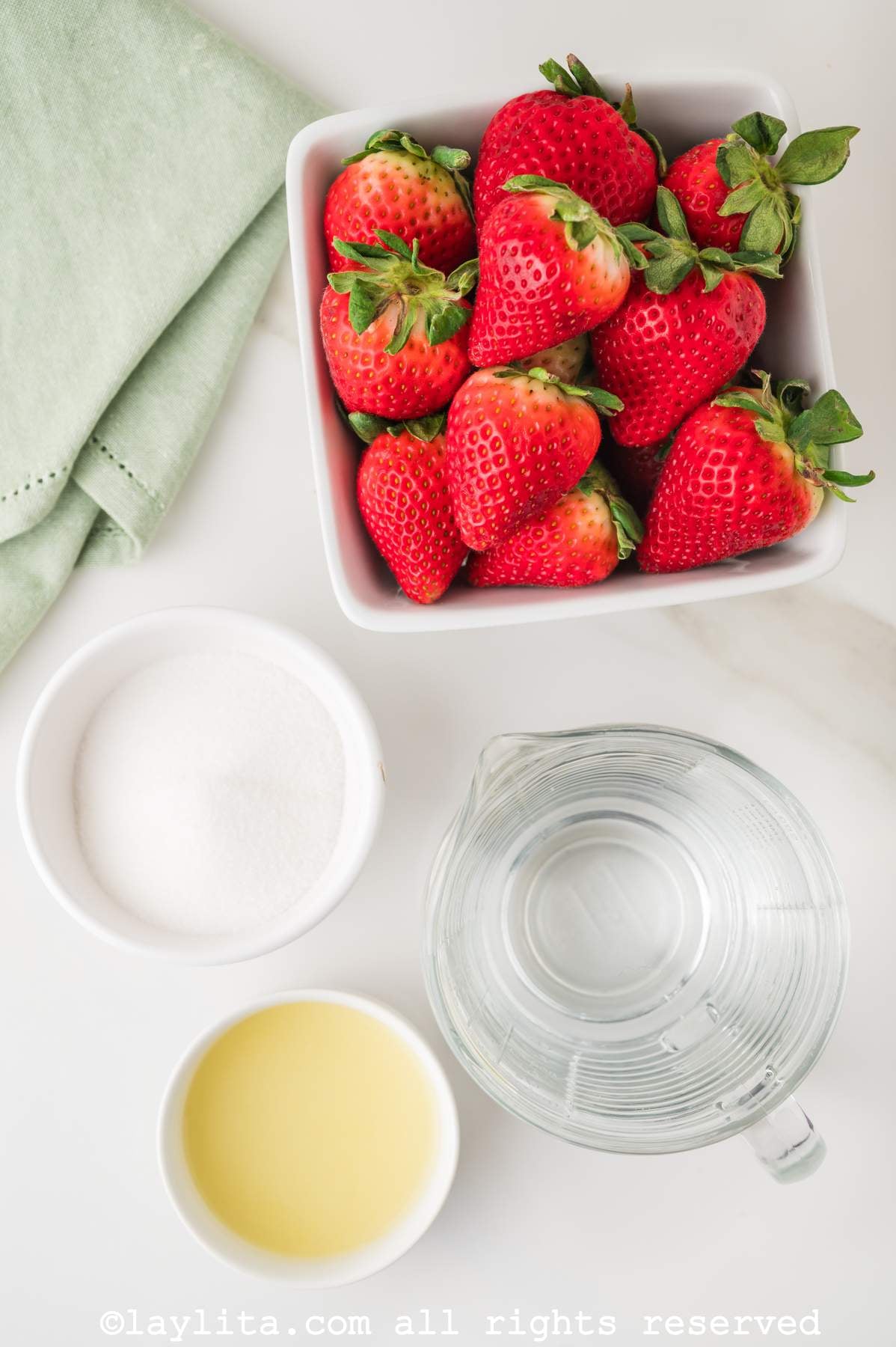Ingredients for Strawberry Agua Fresca on a kitchen counter