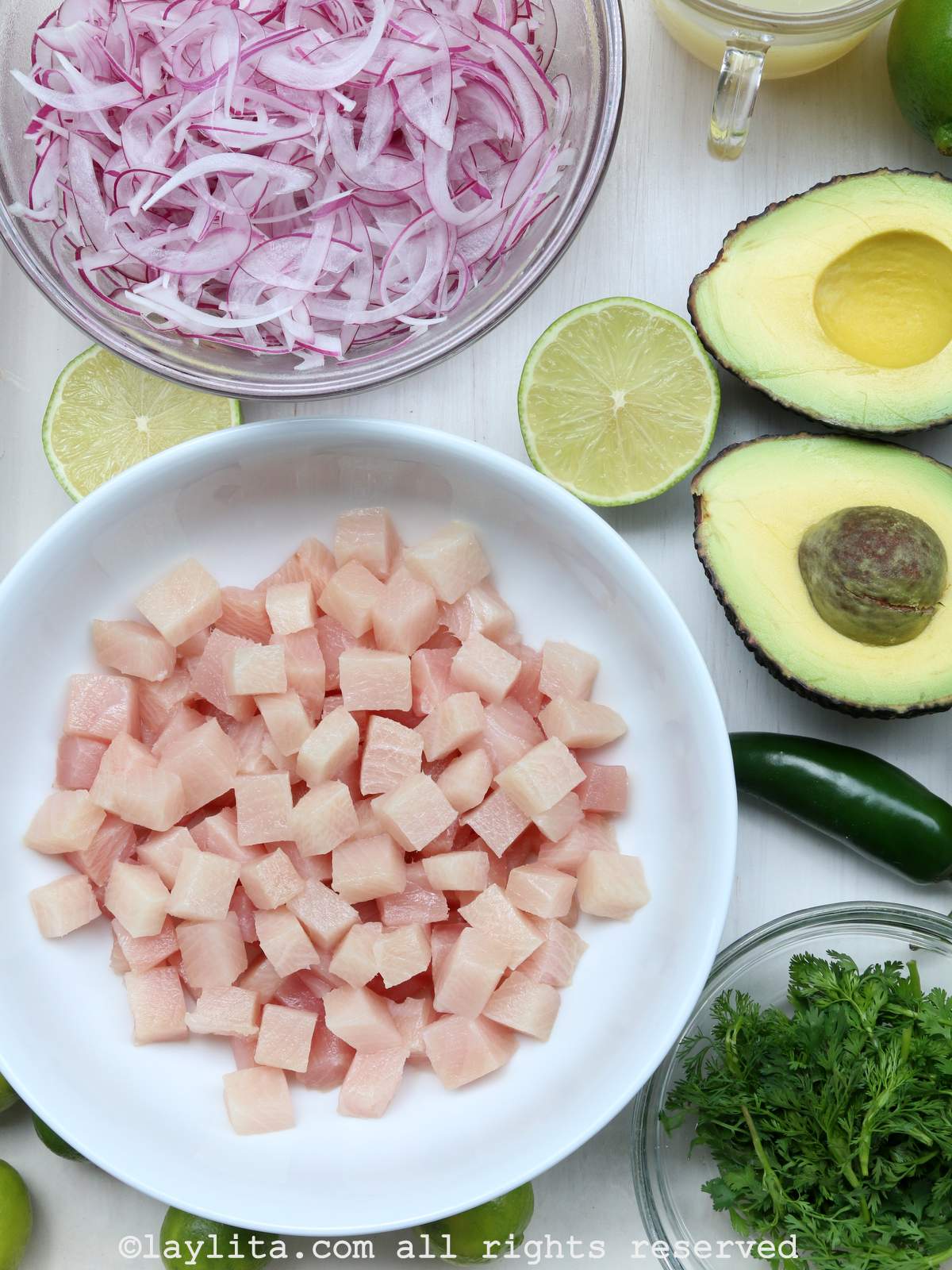 Ingredients needed to make hamachi ceviche on a white table