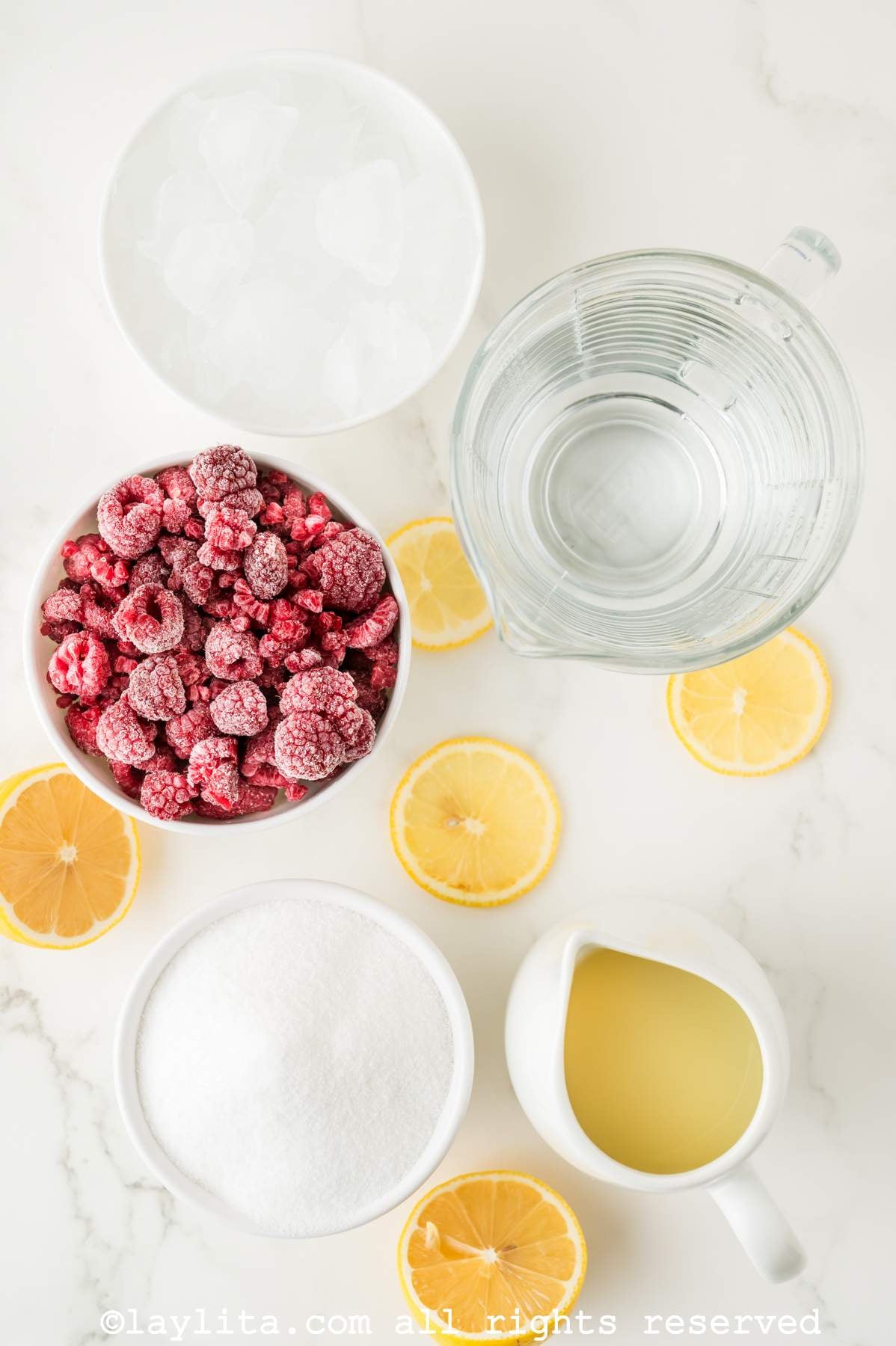 Ingredients for Raspberry Lemonade on a kitchen counter