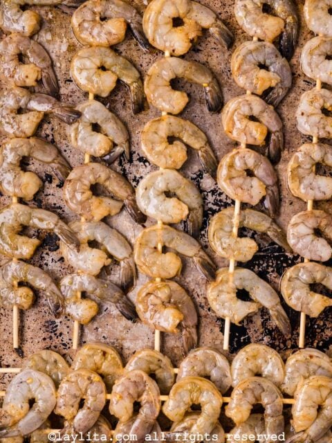 Skewered shrimp on a baking sheet