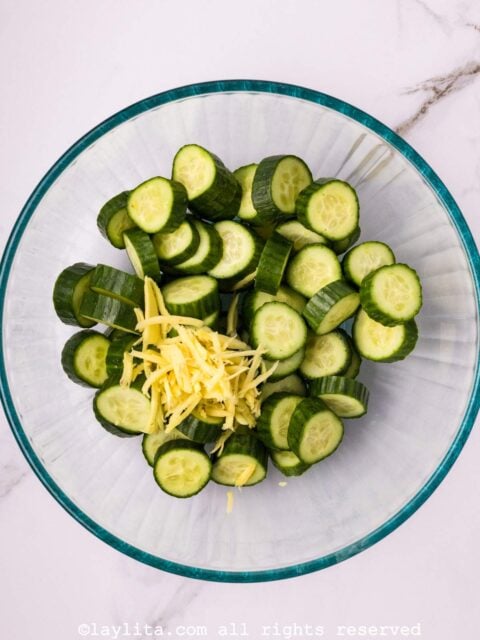 Cucumber slices and grated ginger in a glass bowl