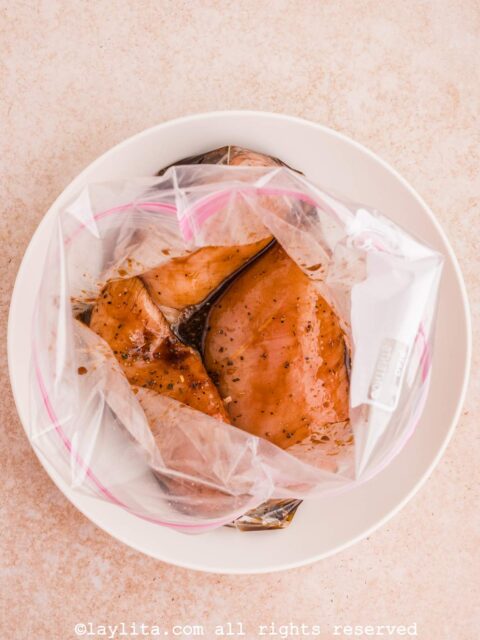 Chicken breasts marinating in a plastic bag