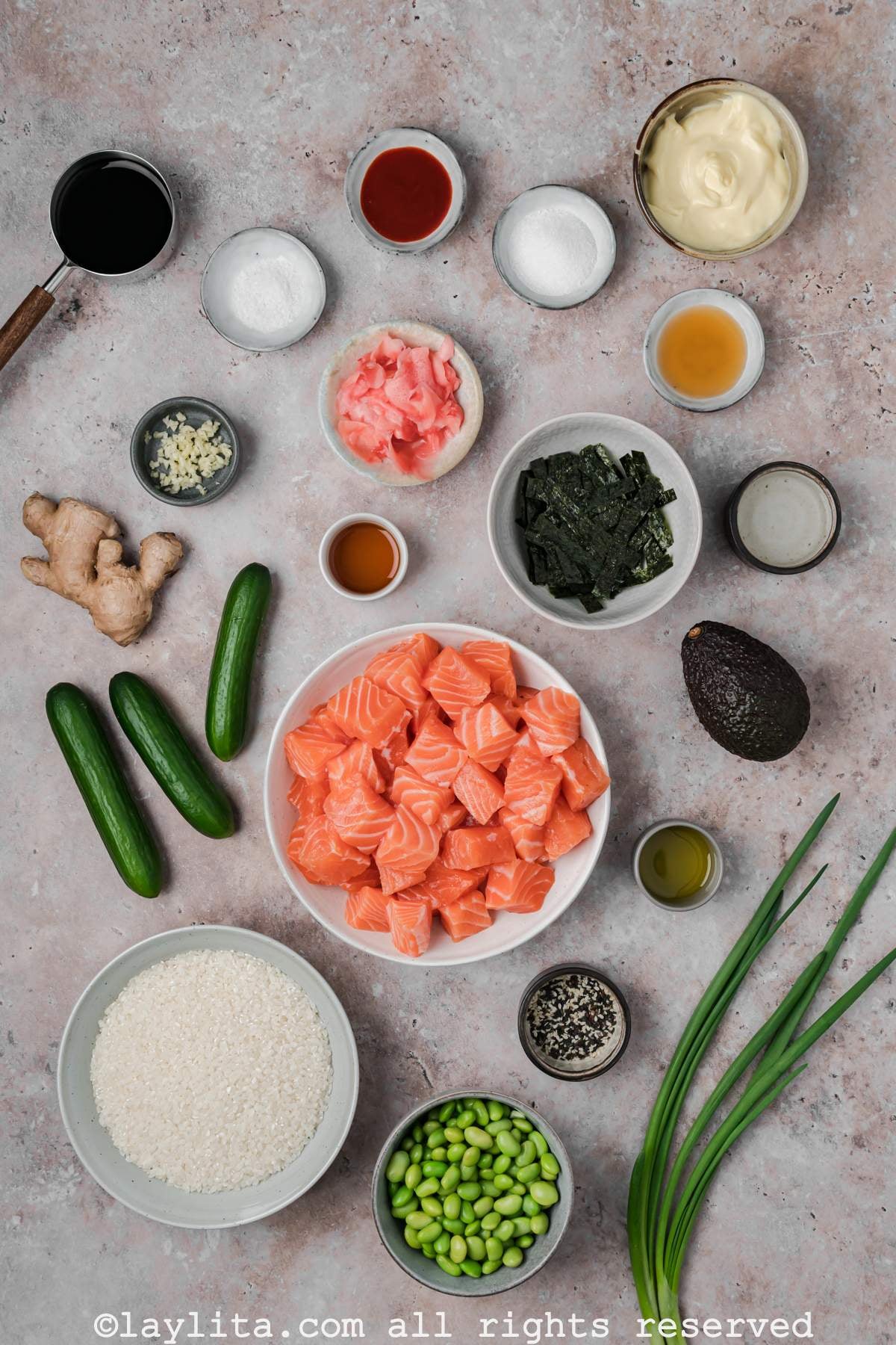 Ingredients needed to make salmon sushi bowls on a counter.