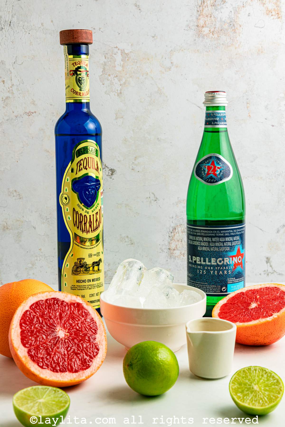 Ingredients for a paloma cocktail on a kitchen counter