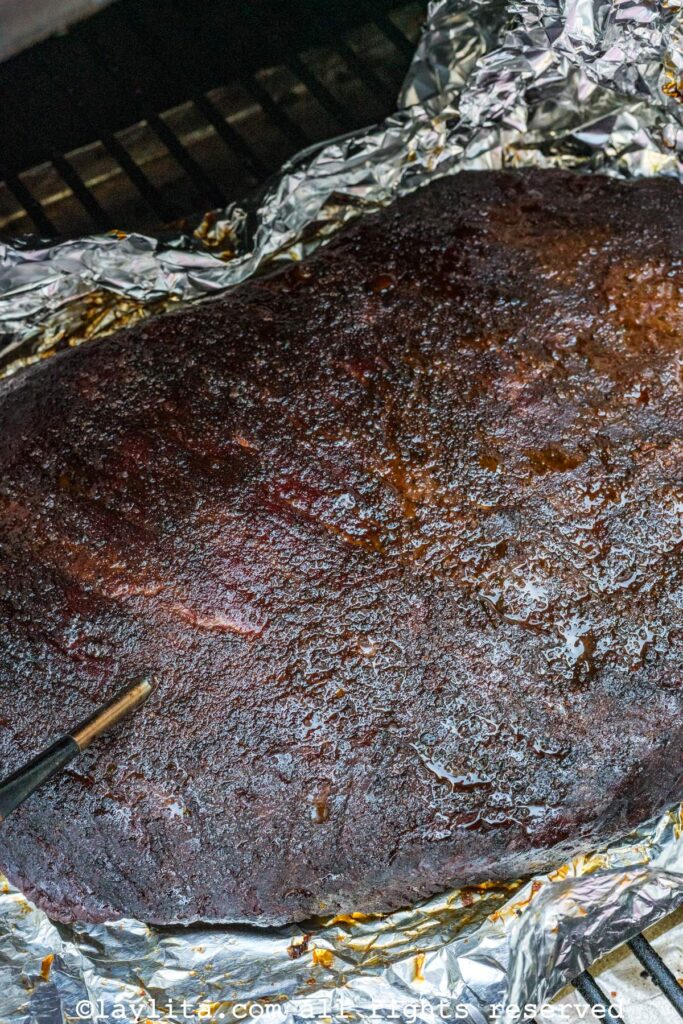 View of a smoked brisket on the grill after cooking