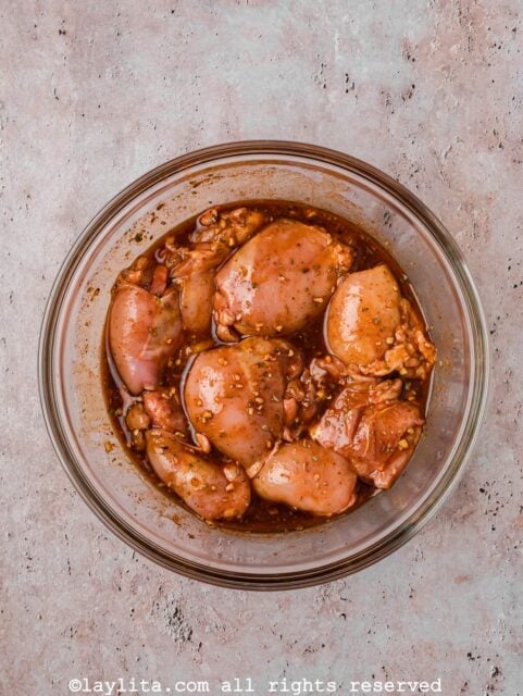 Add chicken thighs and toss until fully coated