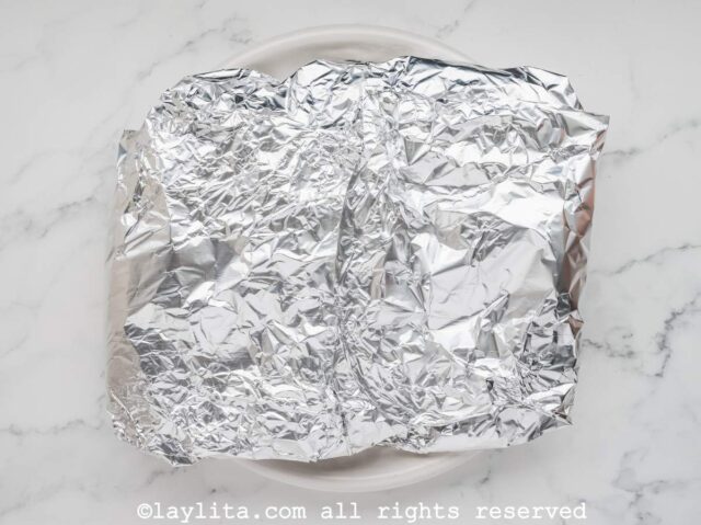 A wrapped brisket in foil
