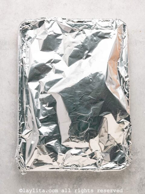A baking tray covered with foil
