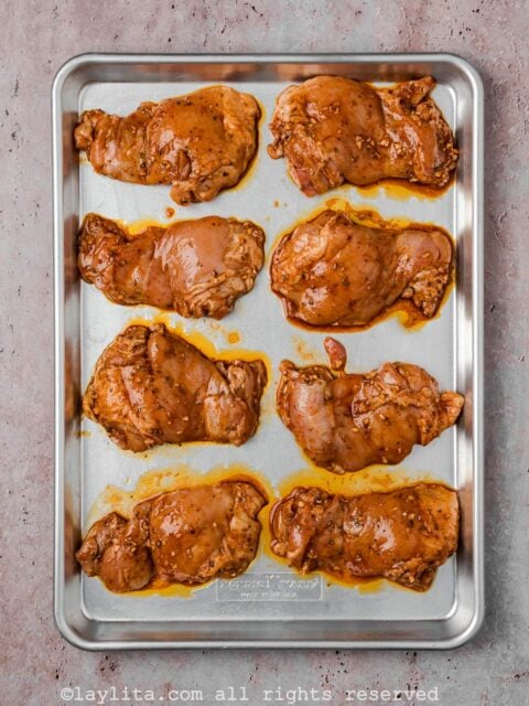 Chicken thighs on a baking sheet
