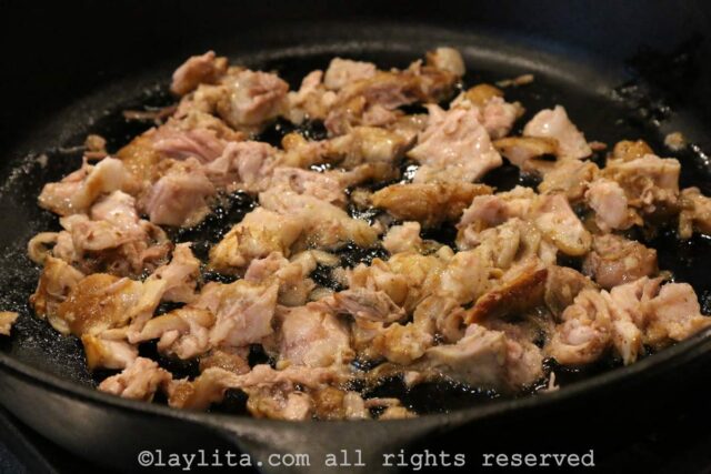 Pieces of fatty pork in a skillet