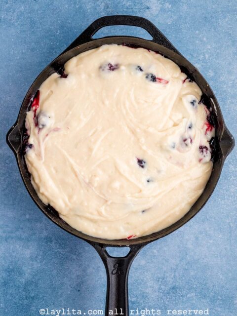 An unbaked blackberry cobbler in a skillet