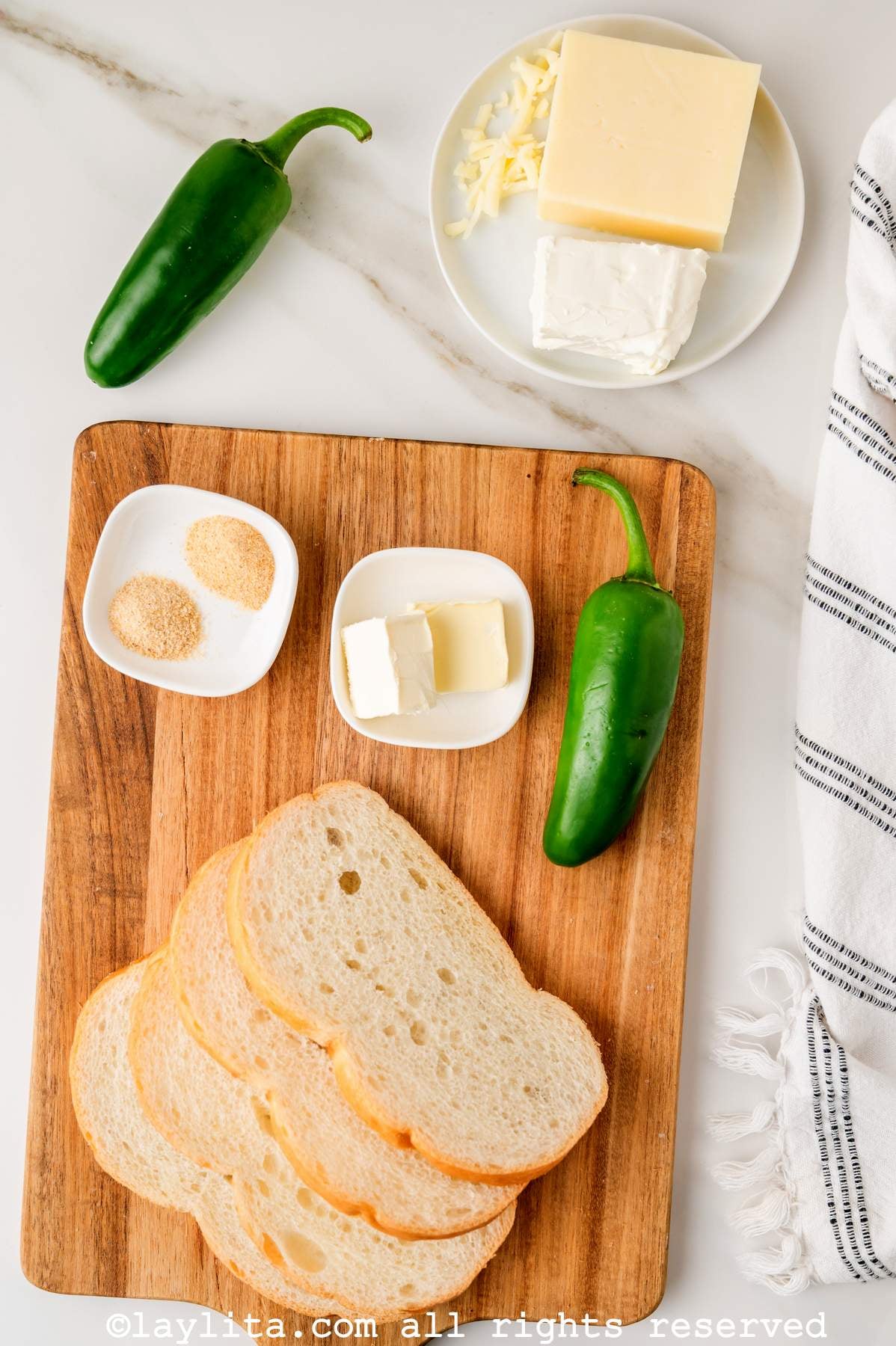 Ingredients for Jalapeño Popper Grilled Cheese on a wooden board on a kitchen counter