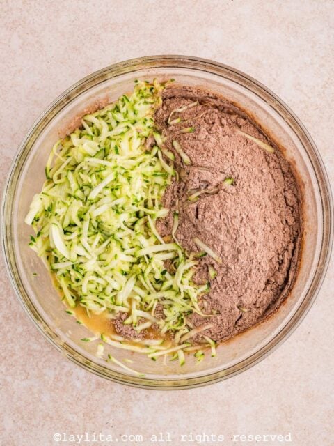 Add the grated and blotted dry zucchini and the dry ingredients and mix until just combined.