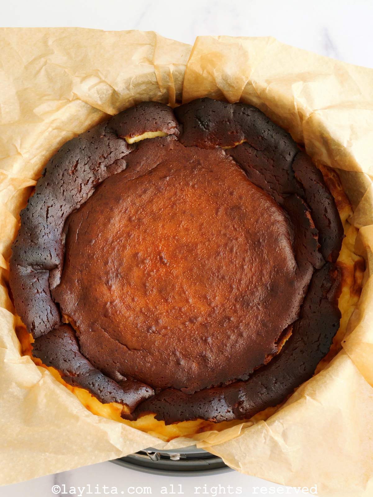 Ovehead view of a fresly baked Basque style burnt cheesecake