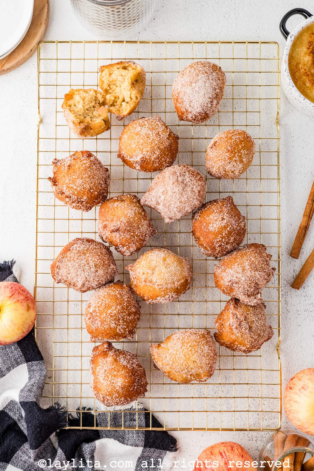 Overhead shot of applesauce beignet fritters on a cooling rack