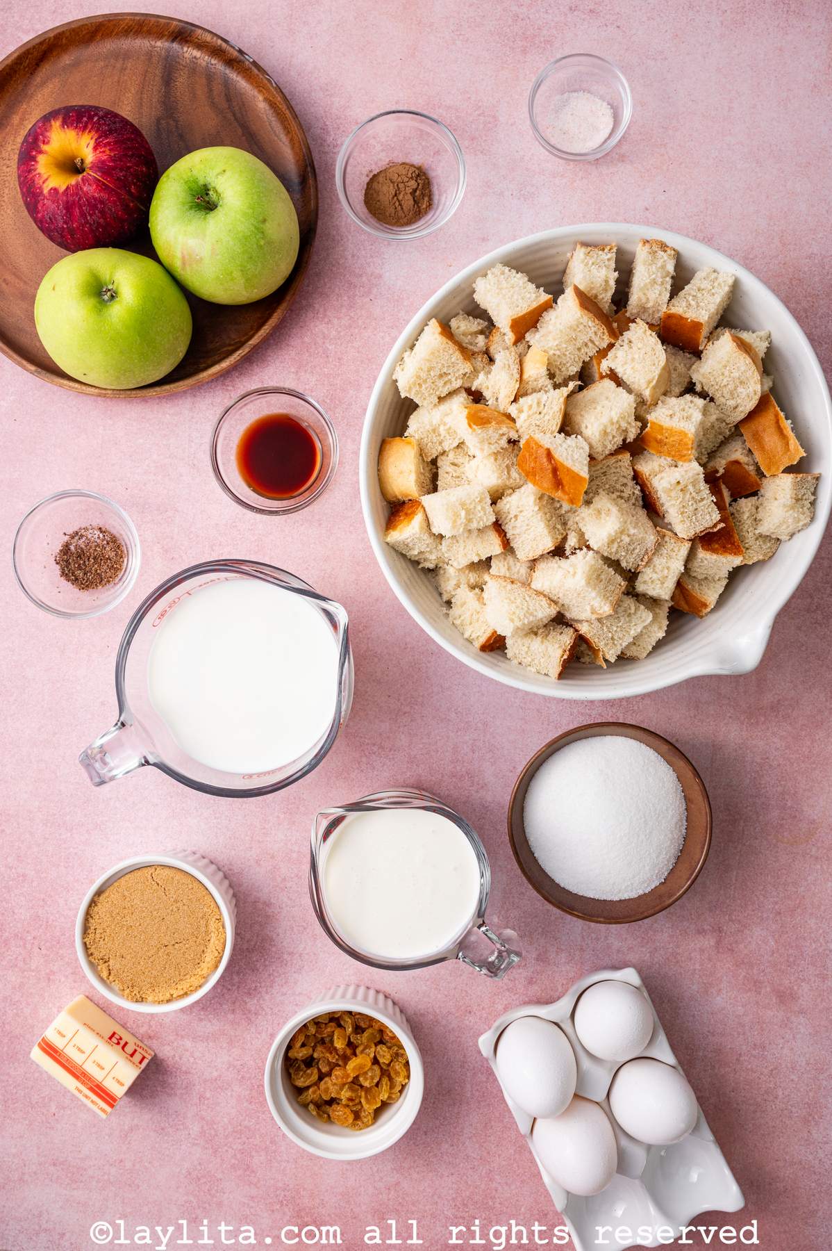 Ingredients for Apple Bread Pudding With Salted Caramel on a kitchen counter