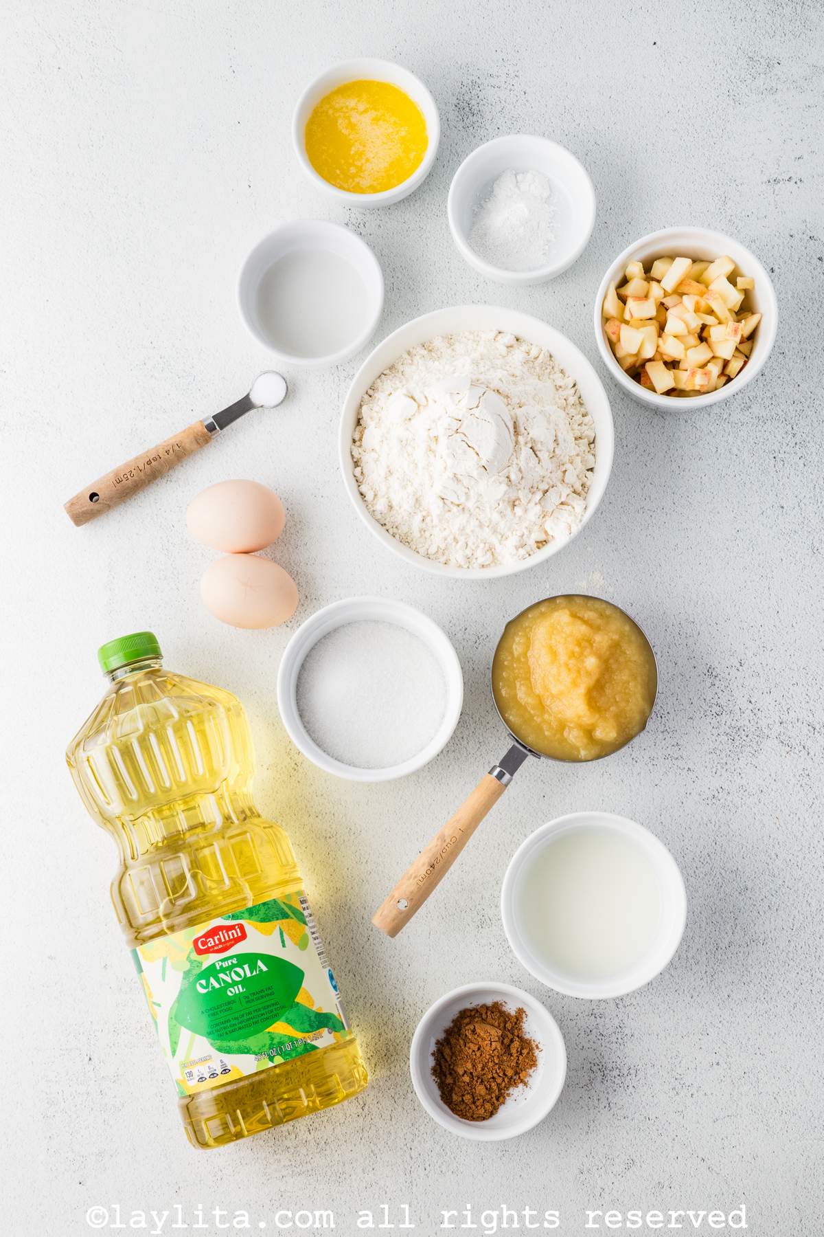 Ingredients for Buñuelos de Manzana or Apple Beignet Fritters on a kitchen counter