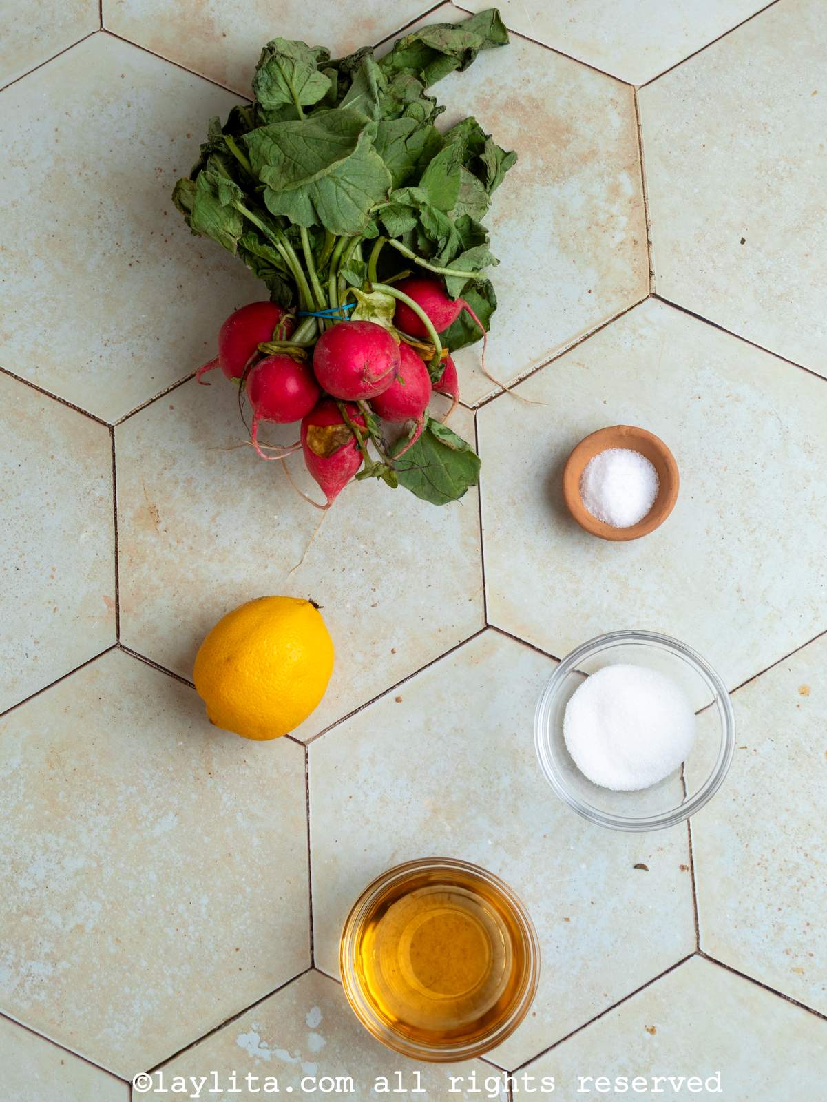 Ingredients for quick pickled radishes on a kitchen counter