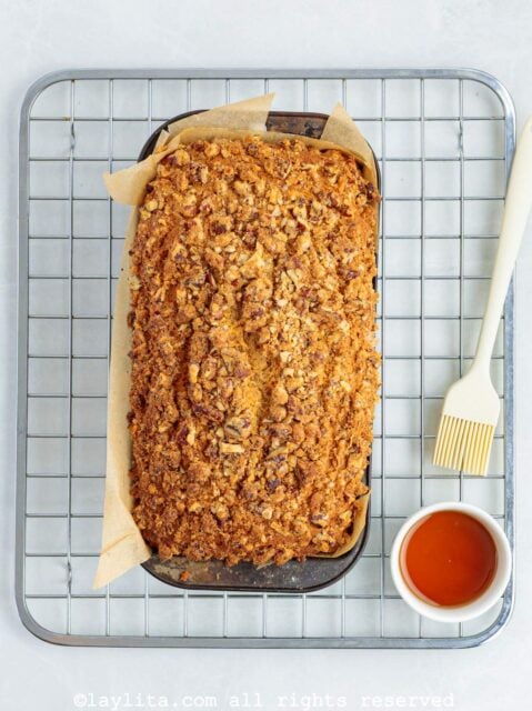 A baked sweet potato loaf on top of a cooling rack