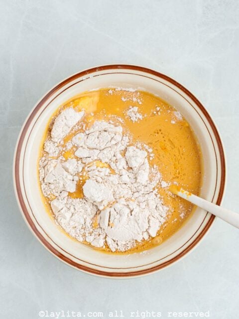 Mixing the dry ingredients into the whisked egg mix