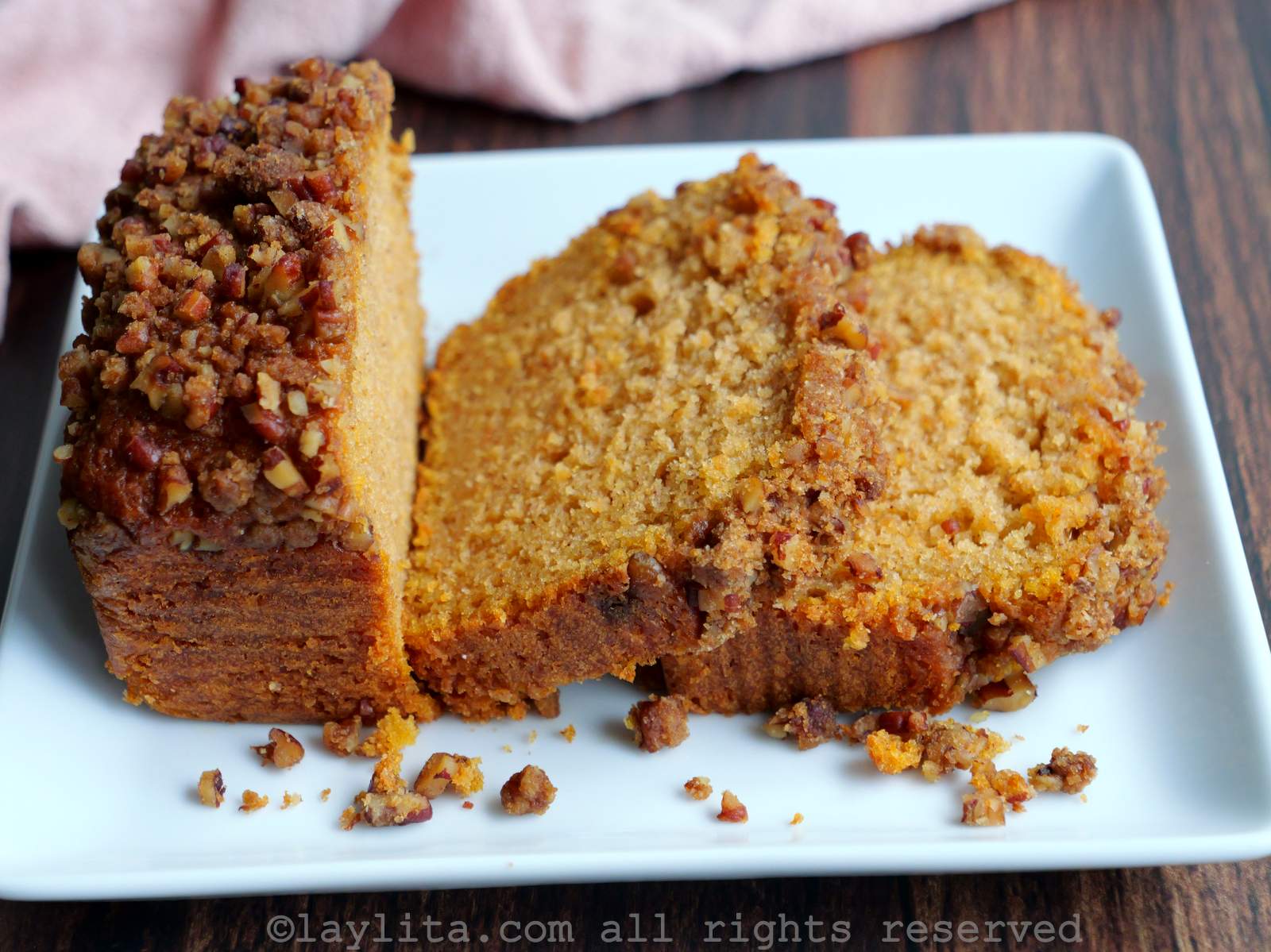Side view of a plate with slices of sweet potato loaf cake