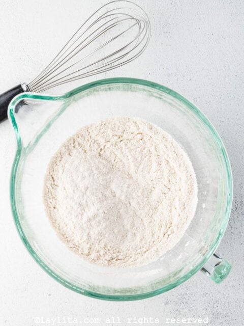 Add the flour, baking powder, salt, ¼ cup sugar, and 1 teaspoon pumpkin pie spice to a large mixing bowl and whisk to combine.