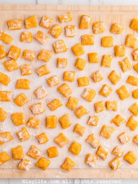 Sweet poto gnocchi on a floured board