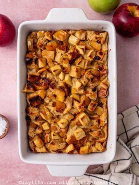 Overhead view of baking container with apple bread pudding after coming out of the oven