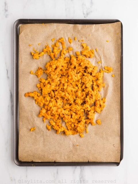 Mashed sweet potato cooling down on a baking sheet