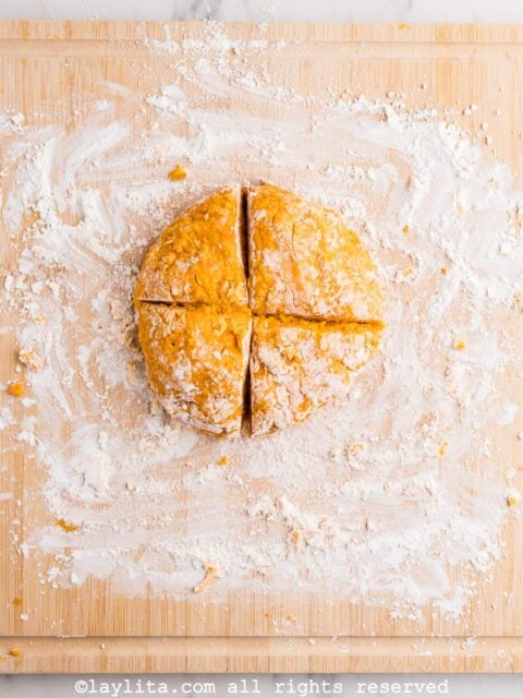 A ball of sweet potato dough cut into four pieces