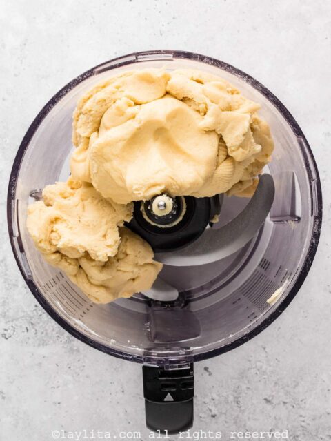 Sweet empanada dough in a food processor