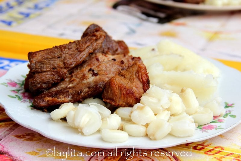 Pork fritada with hominy and yuca in Landangui