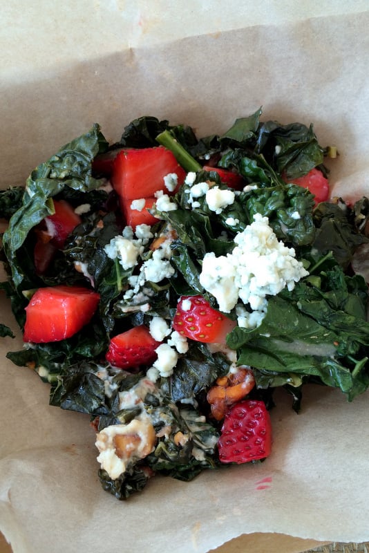 Kale salad with strawberries, blue cheese and spicy candied pecans