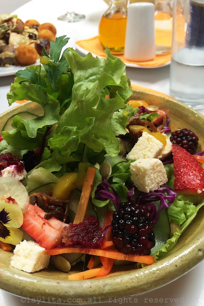 House salad with berries, cheese, caramelized onions and pumpkin seeds