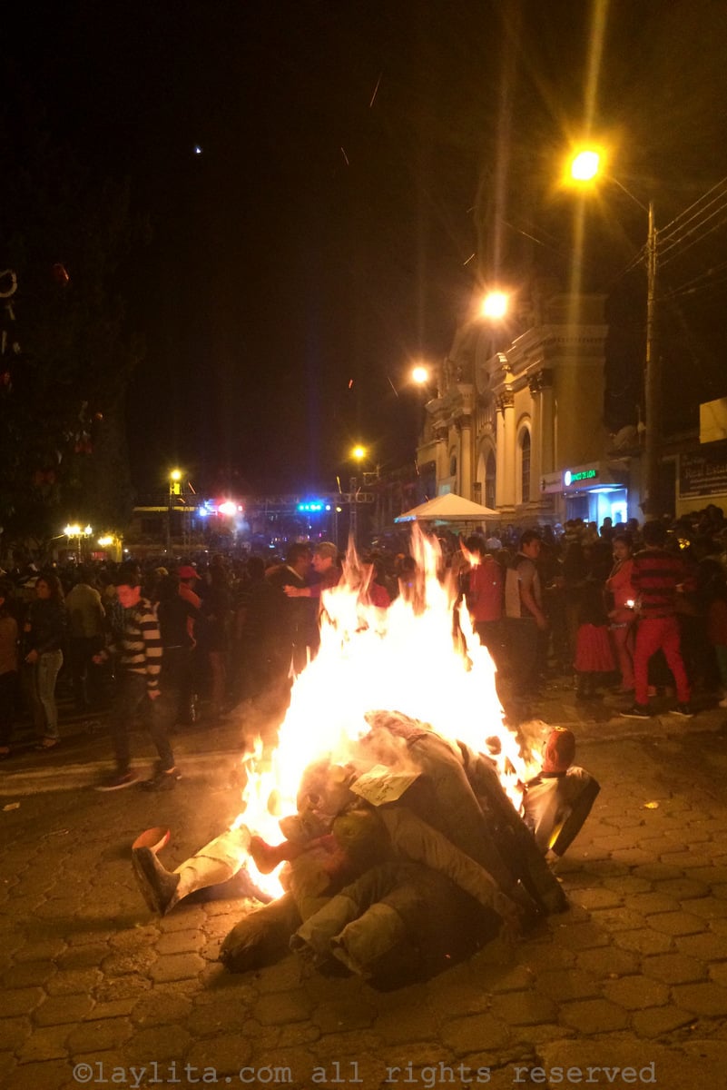 Burning the Año Viejo effigies in the street in Ecuador